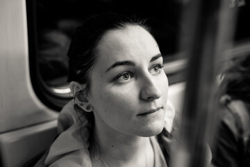 Portrait of a girl in a subway car - 398143950