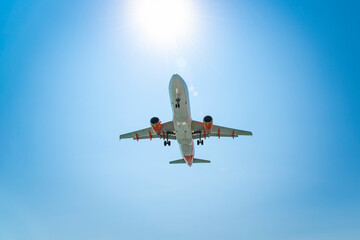 Small plane flying in the clouds on a beautiful sunny day