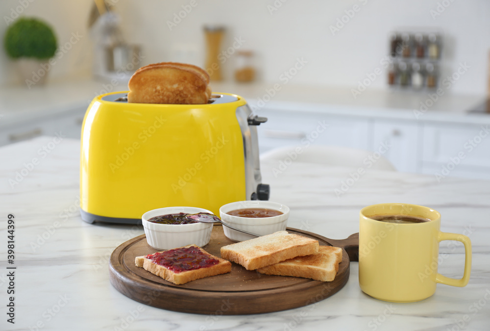 Sticker Modern toaster and tasty breakfast on white marble table in kitchen