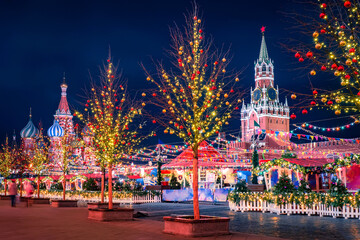 Moscow at Christmas. Holiday in the capital of Russia. Christmas market on red square. Christmas decorations of the city on the background of the Kremlin. New year without snow. Christmas decorations.