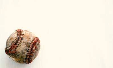 Old grunge texture of used baseball, isolated on background.