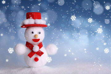 Cute decorative snowman on blue background with snowflakes. Space for text