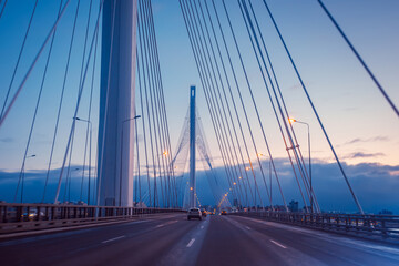 Bolshoi Obukhovsky bridge in Saint Petersburg. Automobile Bridge in Russia. White pillars rise above the bridge. Road architecture of Saint  Petersburg.