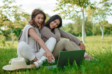 Two Happy Women Looking At Laptop