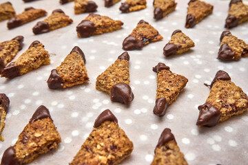 Triangle Nut Cookies Filled With Jam With The Ends Dipped In Dark Chocolate