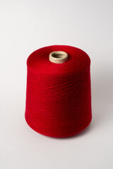 bobbin of yarn on a white background. Side view.Textile reel on isolated white back.