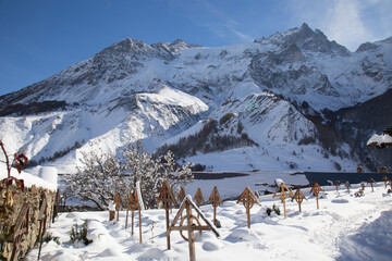 Winter in a Graveyard in the Village of Les Hières situated in a Gorgeous Mountain Landscape in the Haute Alpes department of France