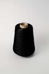 bobbin of yarn on a white background. Side view.Textile reel on isolated white back.