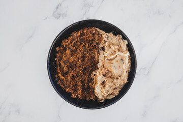 plant-based food, vegan feijoada with black beans and plant-based meat with a side of mash potato