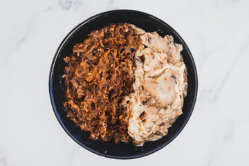 plant-based food, vegan feijoada with black beans and plant-based meat with a side of mash potato