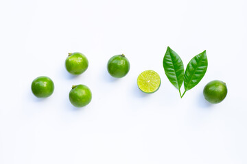 Limes with leaves isolated on white.