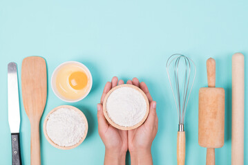 Kitchen utensils and food ingredients for bakery cooking on color background, Top view