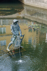 fountain of pissing knight statue in canal at osnabrueck