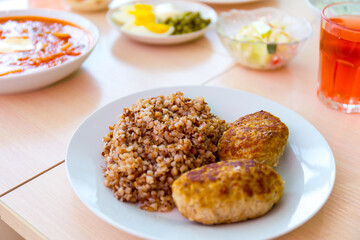 Served tasty meal on the table in restaurant close up view.