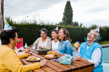 Latin Family happy birthday celebration garden party outside in the backyard in Mexico City