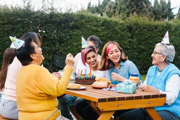 Mexican Family happy birthday celebration garden party outside in the backyard in Mexico City