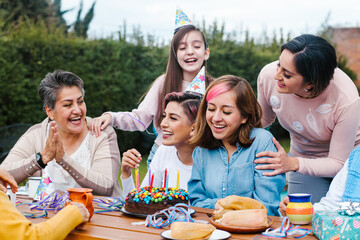 Latin Family happy birthday celebration garden party outside in the backyard in Mexico City