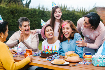 Latin woman happy birthday celebration garden party outside in the backyard in Mexico City