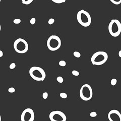 Doodle dots seamless pattern. Hand drawn circles background. Monochrome texture.
