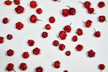 Red hot chilli peppers on white background