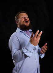 Solid bearded man in shirt singing opera