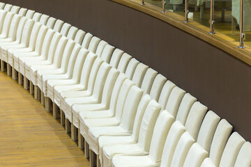 Rows of chairs at conference room close up view.