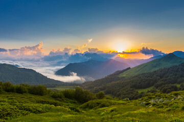 Beautiful mountain landscape at Caucasus mountains with clouds and blue sky
