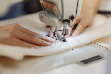 sewing machine scribbling fabric. tailoring at the factory