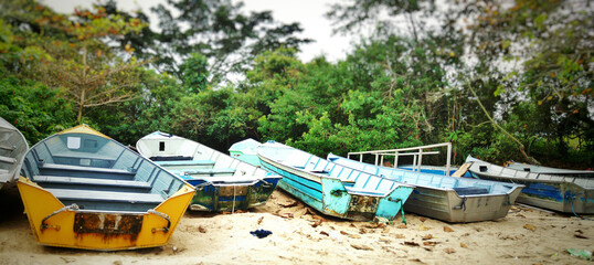 Set of fishing boats on the beach sand