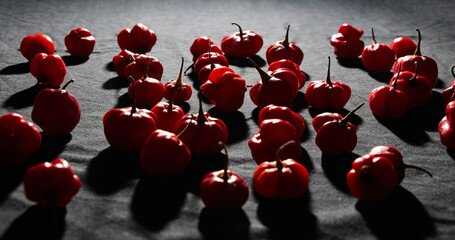 Red hot chilli peppers on black background