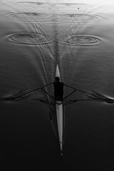 Black and white kayak closeup top view sports rowing water ripples dramatic scene in Plovdiv, Bulgaria