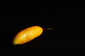 Red hot chilli peppers on black background