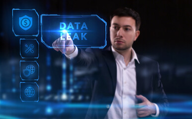 Business, Technology, Internet and network concept. Young businessman working on a virtual screen of the future and sees the inscription: Data leak