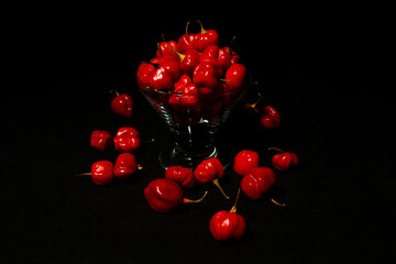 Red hot chilli peppers on black background
