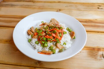 pork and vegetable fried on hot rice - Thailand healthy food