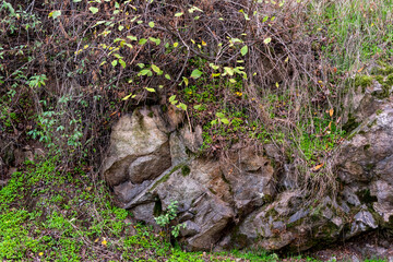 Naklejka na ściany i meble Textured stone background hard surface rock mountain trail