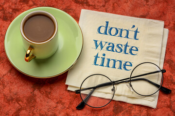 do not waste time - inspirational handwriting on a napkin with a cup of coffee, business,...