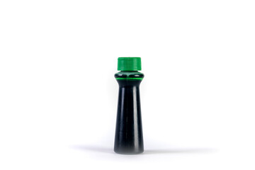 Green food coloring bottle isolated over white