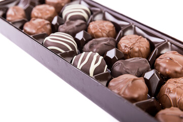 Close up angled view of a box of milk and dark striped chocolates