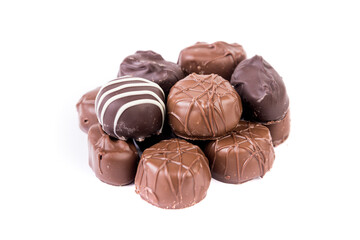 Ten pieces of milk and dark striped chocolates in a pile