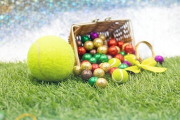 Tennis Easter Holiday with tennis ball and colorful ball in basket 