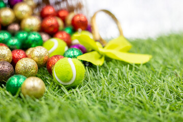 Tennis Easter are on green grass with lots of balls