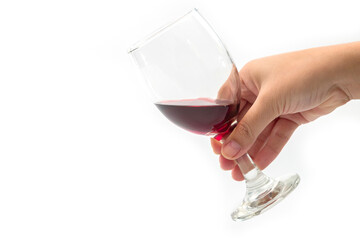 Holding a glass of red wine