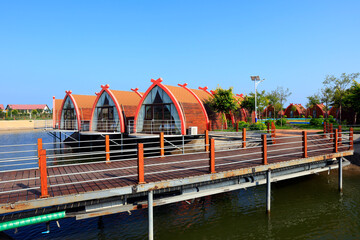 Wooden houses on the water,  log cabins by the sea