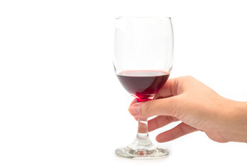 Holding a glass of red wine
