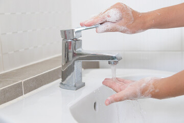 Washing your hands with soap for cleaning helps prevent germs