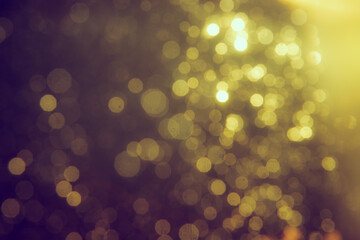 Gold bokeh blur defocus in black backgeound