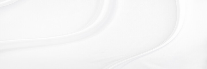 White gray satin texture that is white silver fabric silk panorama background with beautiful soft blur pattern natural.