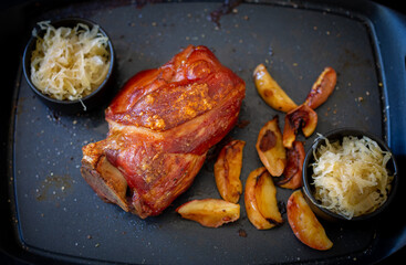 Bavarian style Pork Knuckle with Sauerkraut and baked apple