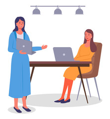 Office meeting and consideration of working affairs. Office workers women discussing project. Businesswomen dressed in formal clothes siting at the table with laptop, standing in room and talking